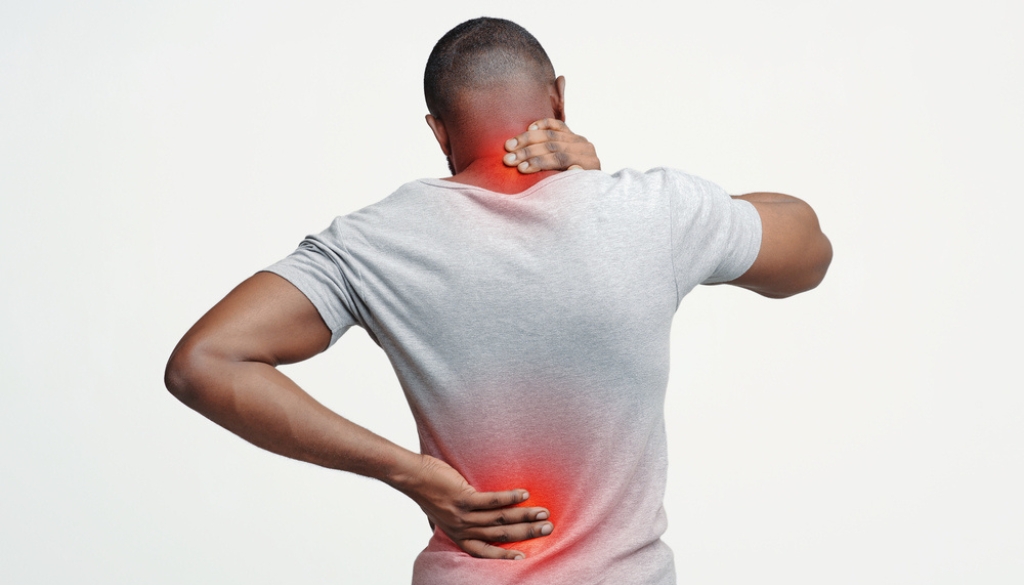 Clinical specialist using targeted therapeutic massage and myofascial release techniques on a patient's neck and upper shoulder area