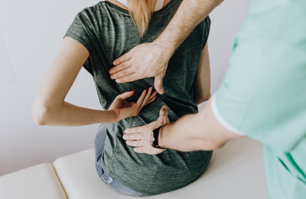 A patient undergoing automated physical mechanical lumbar traction therapy on a clinical decompression bed